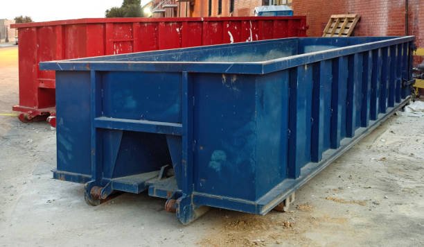 red and blue industrial dumpsters.